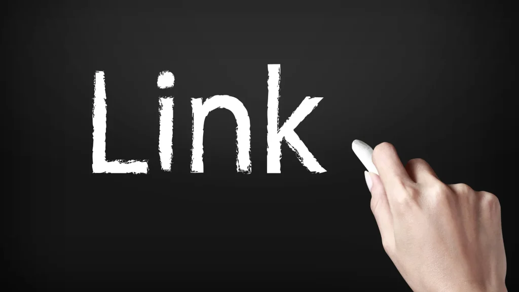 Handwriting 'Link' on a blackboard representing Link Building Packages Prices for SEO and website ranking improvement.